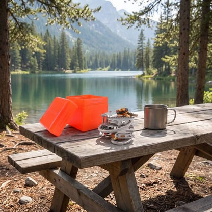 Réchaud camping gaz FlexFlam plié avec sa boîte au lac